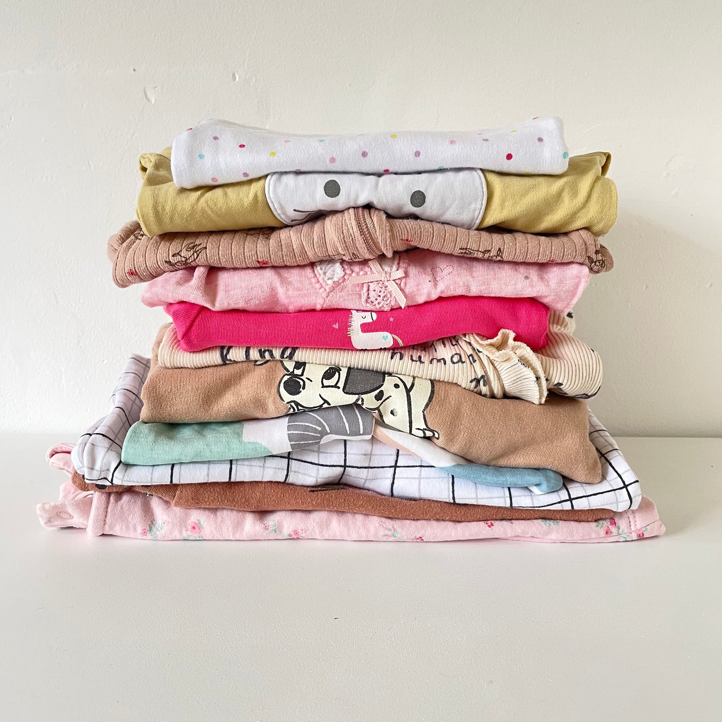 Stack of baby clothing
