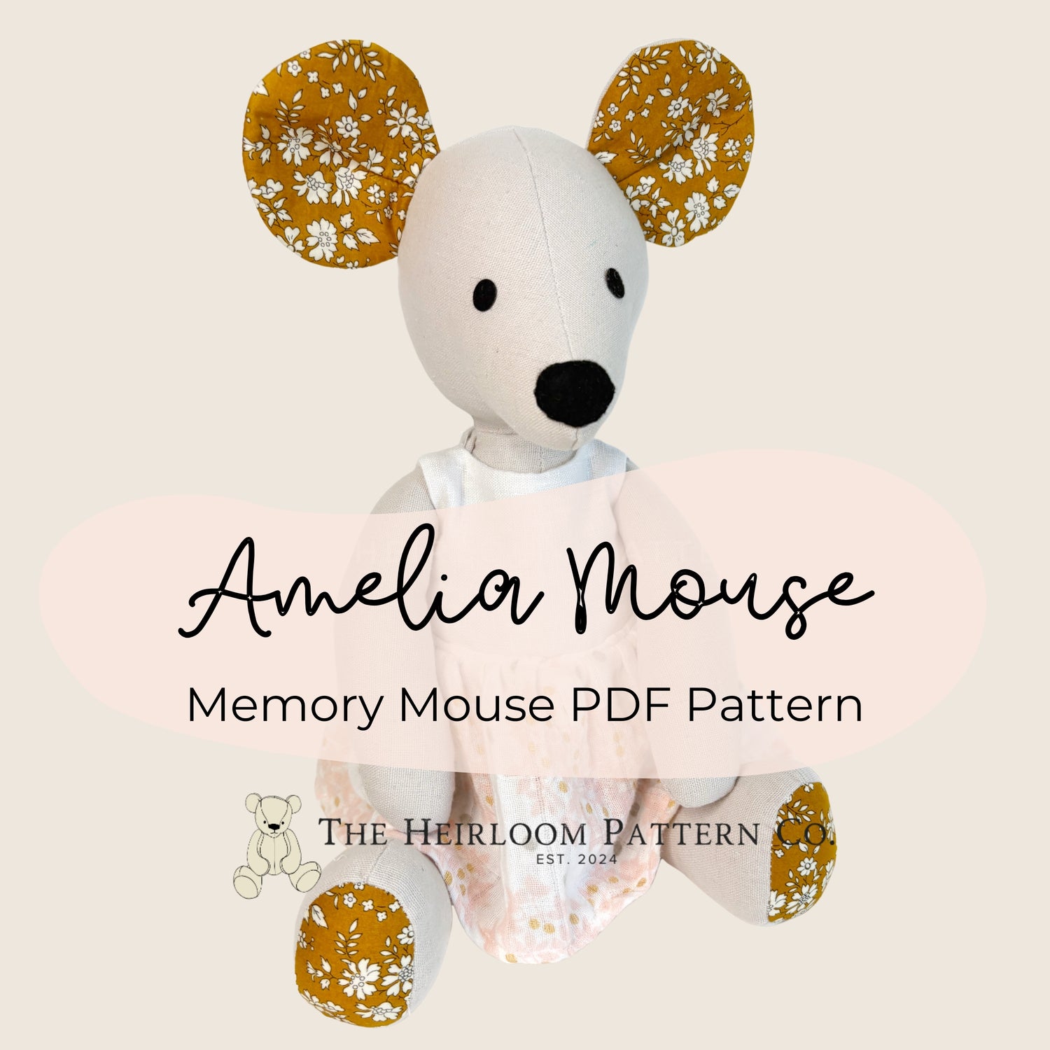 Stuffed mouse toy with floral ears and text 'Amelia Mouse Memory Mouse PDF Pattern' on a beige background.