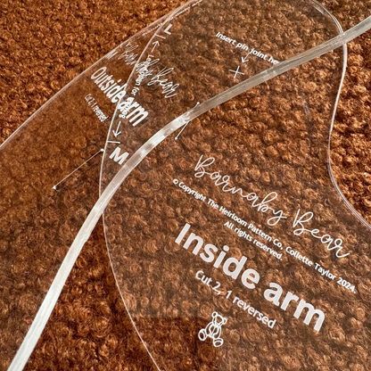 Clear acrylic Barnaby bear pattern guide with text on a brown textured background